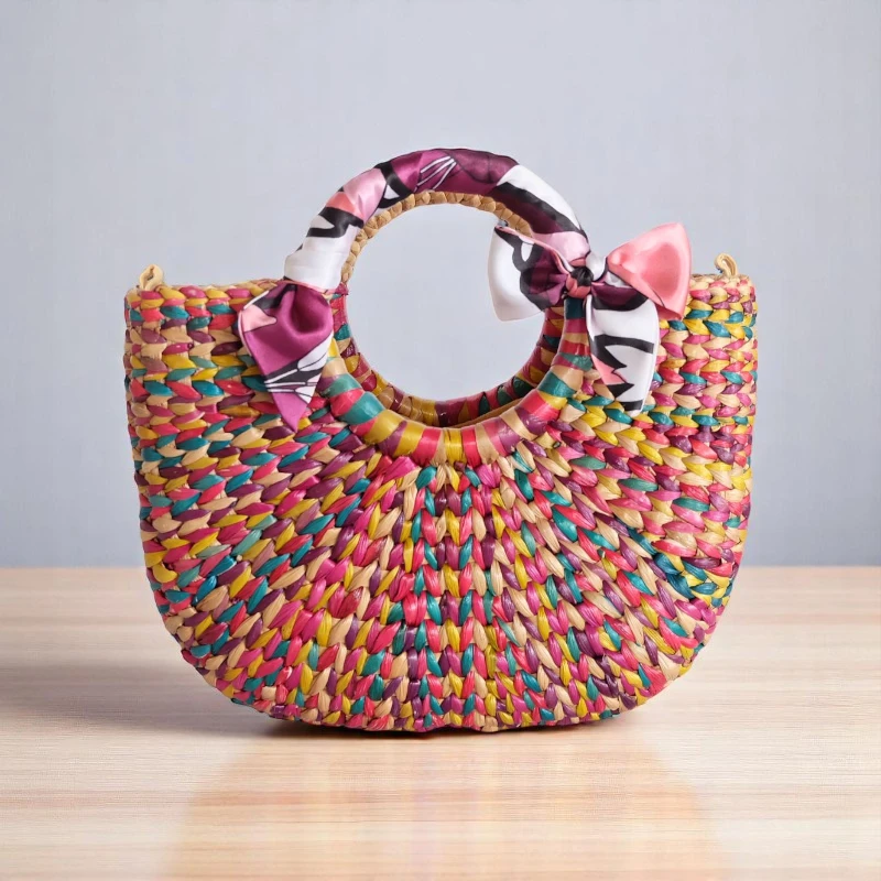 Kanchana Rainbow Straw Handbag – Ethical, Fun & Handmade with silk bow and colourful weave, handcrafted in Thailand