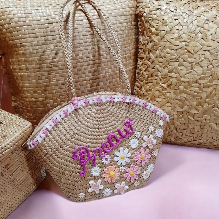 Chada straw raffia bag with floral embroidery and “Preaw” script, handmade in Thailand using eco-friendly materials for summer style
