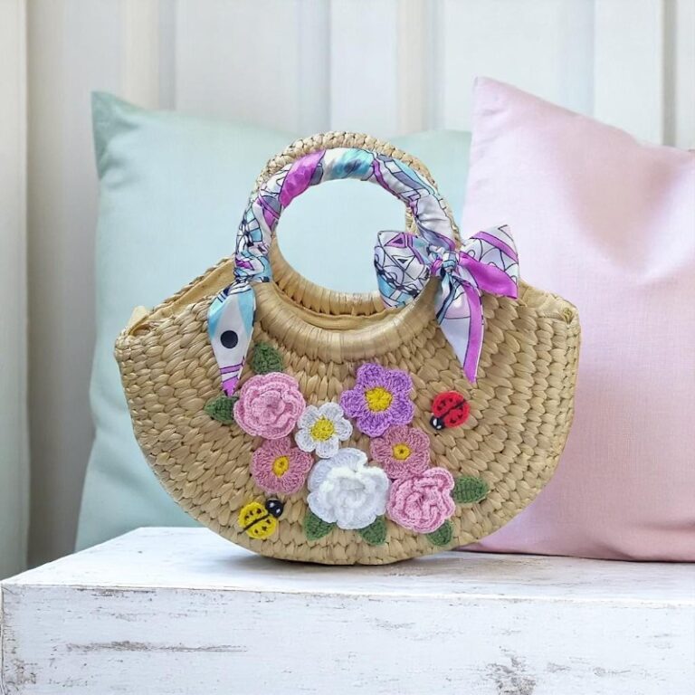 Mini half-moon straw purse with crochet flower embroidery and scarf-wrapped round handles