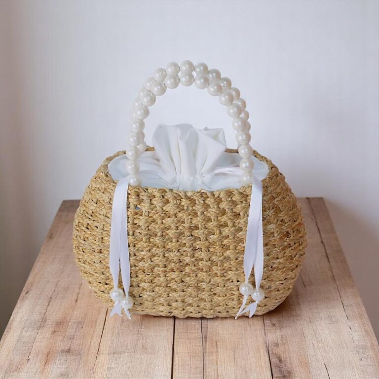 Chantra Pearl Handle Straw Bag with White Drawstring Lining – handmade mini straw tote with pearl bead handles and soft white cotton pouch, crafted in Thailand