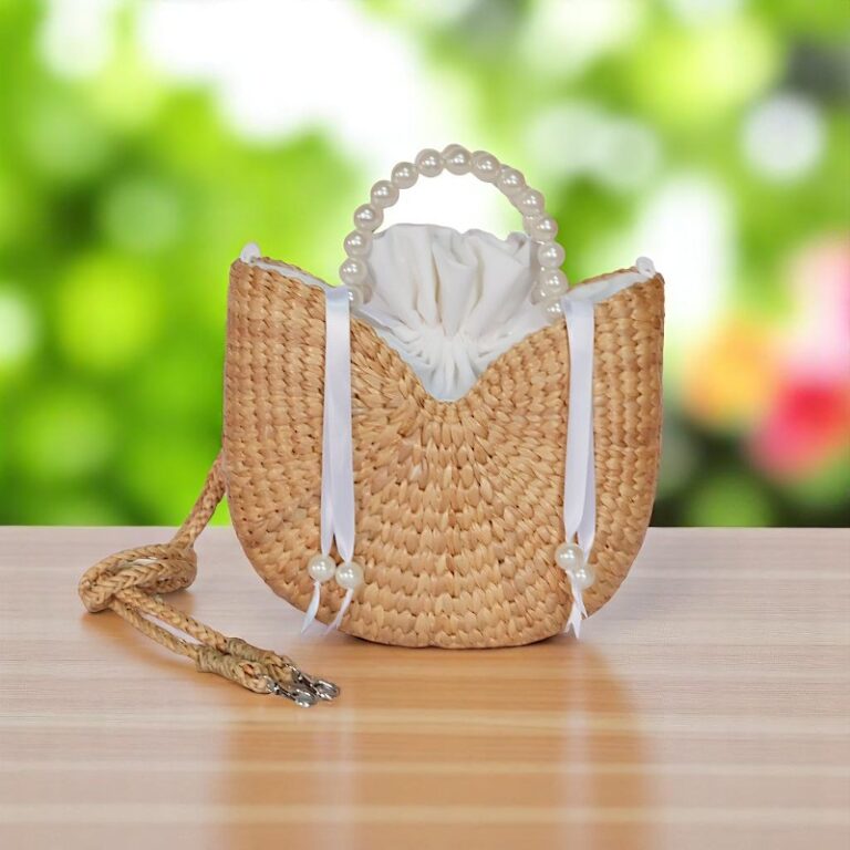 Pimwara Pearl Handle Ladies Straw Bag – handcrafted crescent straw bag with pearl handle, drawstring cotton lining, and white ribbon detail