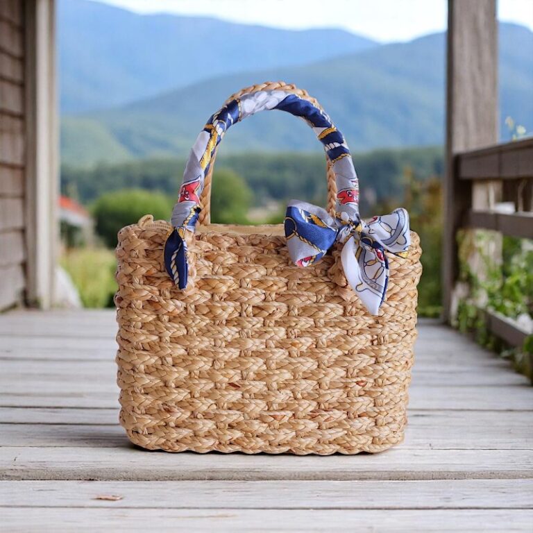 Chanisa Navy Ribbon Wedding Straw Tote – handmade bridal straw bag with navy and gold ribbon bows, structured rectangular shape, and vegan straw weave