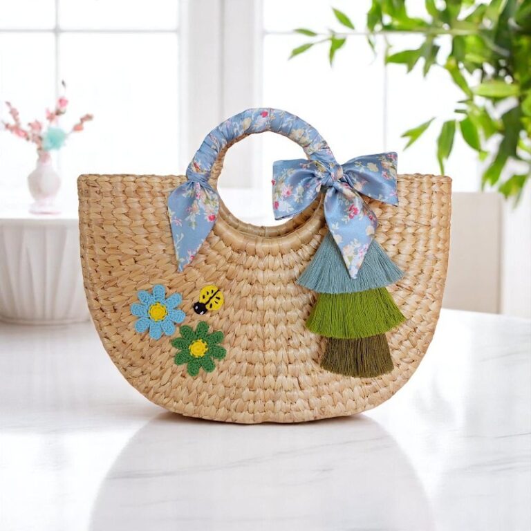 Duangjai Floral Tassel Summer Straw Tote – round straw bag with tassels, ribbon handle, ladybird embroidery and floral appliqués